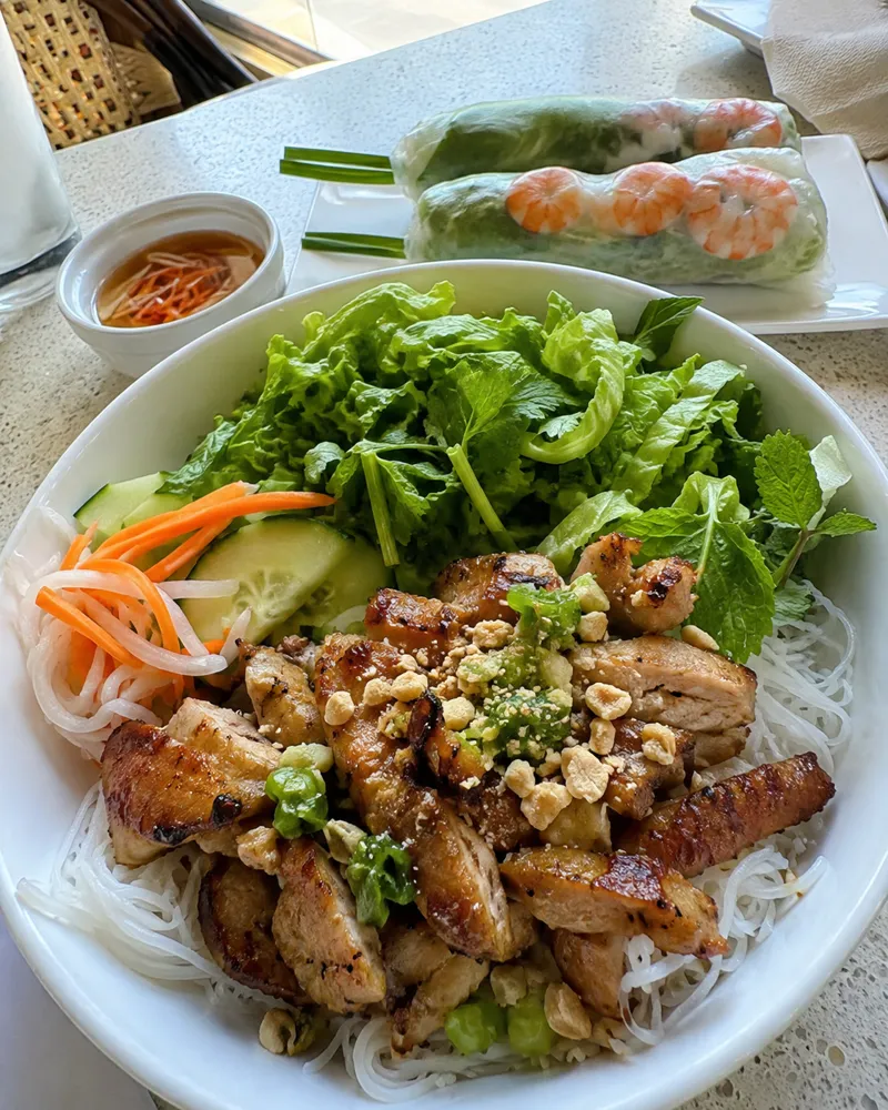 A Vietnamese noodle bowl with summer rolls