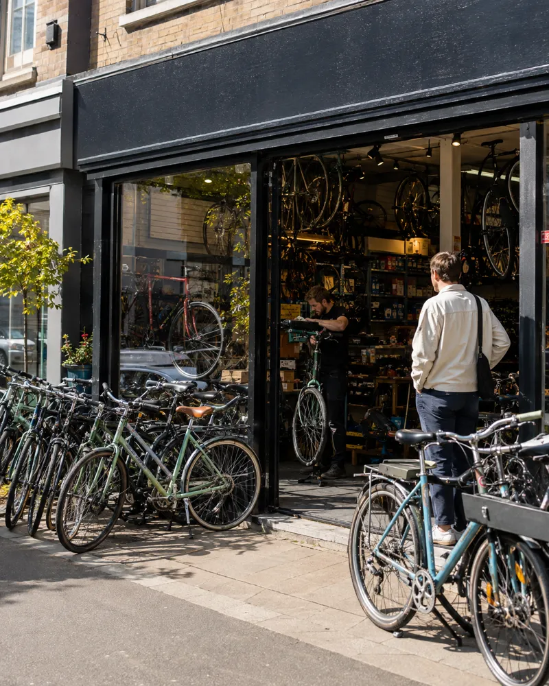 Bikes lined up outside a repair shop