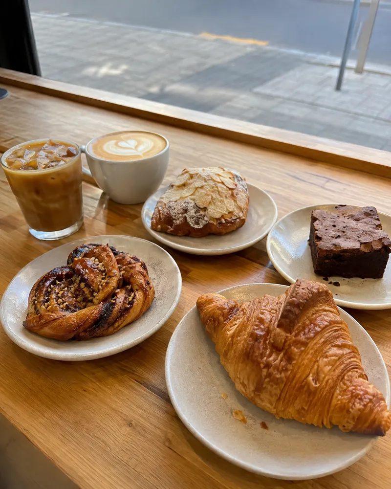 Coffee and pastries at a café window