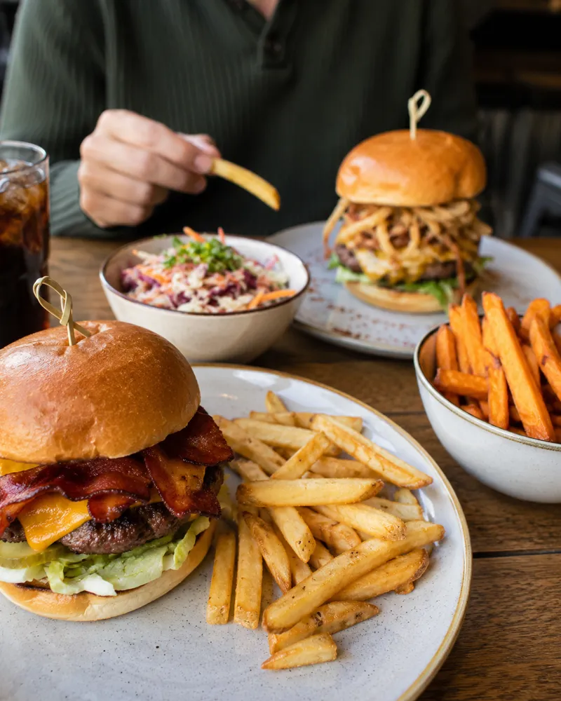A smash burger with fries